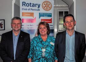 Neil Austin with club member Gordon Mann on the left and President Rhona Somerville.