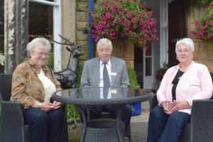 President Suzanne Mackey, visitor host Gordon Robb, Vice President Donna Doradis