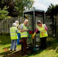 The team hard at work preparing the old phone box