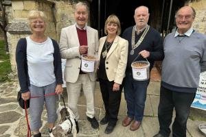 Handing over the Rotary Club crocus bulbs to Tenterden Wildlife for planting