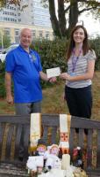 Rotarian Terry Morris presents a cheque for the boxes to Kayley Donovan of MSE Fundraising Department