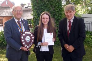 President David Davies (L) and Chairman of The Marches Local Governing Body Mark Liquorish (R) present the award to Rebecca Manford
