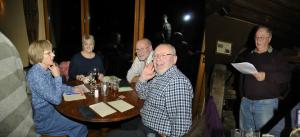 The winning team Marje, Margaret, John, Norman with Quizmaster Paul in full flow 