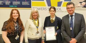 Club President, Renate presents Towers School pupil, Megan Tasker with the First Prize Certificate for the local level of the ‘Young Writer of the Year’ 