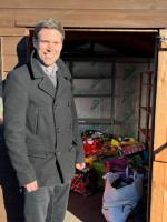 Chris Verney from Martin House receiving the toys