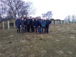 The Bradford Blaize tree planting team with the planted trees in the background