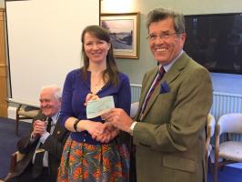 Presentation of our Club's cheque to Ailsa for the work of Visoi by President Peter