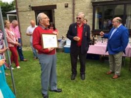 John holding his certificate and delighted to be a Secretary Emeritus.