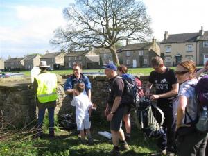 Walker get a welcome drink at the East Witton checkpoint