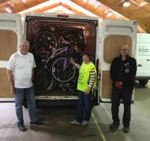 Rotarians Bob Taylor and Jackie Wellman deliver the latest collection of bikes to the Re-Cycle Charity