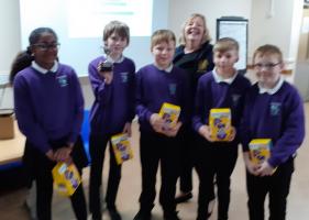 The winning team from Glashieburn receive their trophy from Rotary Vice President Mary