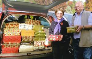 Rtn Mike Richardson and a Guide collect Christmas boxes for service personnel