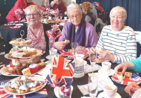 Three Tea Club members enjoy the celebration
