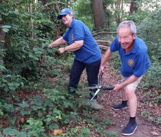 Kingston members clearing foliage at Yorda Playhouse