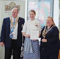 Amy is pictured receiving her certificate from RIBI President Debbie Hodge - photograph by Donald MacLeod