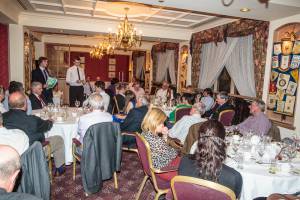 A packed audience listens intently to a series of excellent presentations.