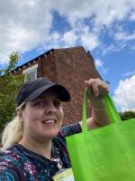 Volunteers distribute well being bags

