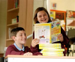 Olver Johnston and Georgina Yates at St Joseph's Roman Cathlic Primary School Darwen, were delighted with the Pictorial Dictionaries presented to the school by the Rotary Club of Darwen