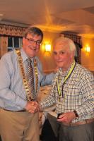 Tony Bruce is presented with a Paul Harris Fellowship award