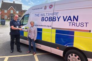 Douglas Batchelor of the Bobby Van Trust with club President Linda Locke