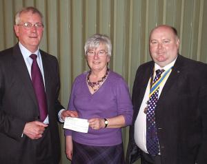 Helen Chandler, centre, with Husband Anthony, left, and President John Lattimore, right. 
