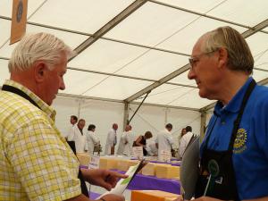 Two stewards checking the details while the judges gather