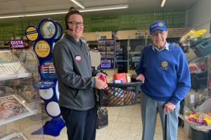 Club member John Wallis receiving a goods donation for our fundraising coffee morning in support of Ukraine
