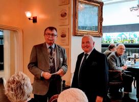 President Ed presents a cheque  to Rtn. Keith Johnson