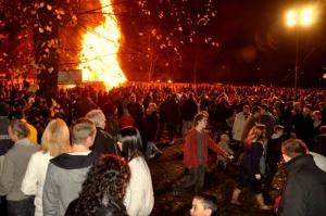 Crowd around bonfire