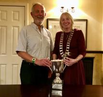 President Liz Baxter presents Rotarian Stewart Lee with the Changeover Golf trophy 2018-2019