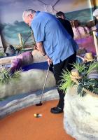 President John honing his golf skills!