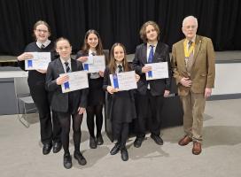 Young pupils receiving their certificates 