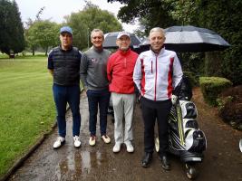 Team Myers & Co were the 1st to tee off and had the worst of the weather.