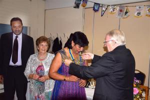 President Jaz Dhaliwal receives her chain of office from IPP Don Simpson.