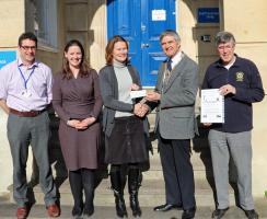 President David Price presenting a cheque for £3500 contributing to a scanner for breast cancer. 