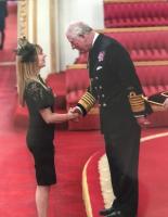 Nikki gets her MBE from Prince Charles