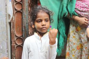 Amna showing her marked finger after receiving the life-saving polio vaccine in Karachi, Pakistan – one of the two remaining endemic countries.© WHO/EMRO