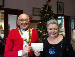President Bill Farmer presents a cheque for Â£250 to Carol Warren, the manager of the Hockley and Hawkwell over 55's Club