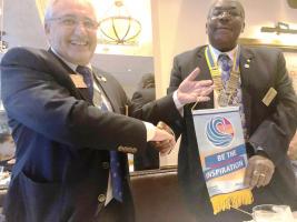 President Juvenal Shiundu Receives the District Governor's Flag