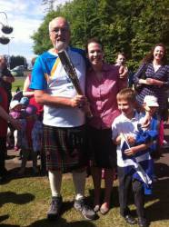 Dunfermline Carnegie Rotarian, Allan Prentice, carrying the Queen's Baton prior to the Commonwealth Games.