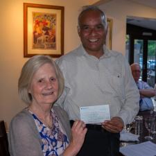 Club President Ravinder Sharma hands over Â£500 cheque,funds raised at our recent Piano Recital, to Jane Carmody from SOS!SEN.