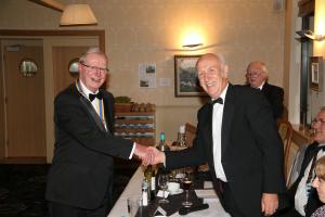 Howard Binks receives the Presidents Jewel from John Morton
