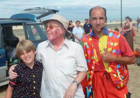 Entertainers Steve and Kai with Rotarian John Busby