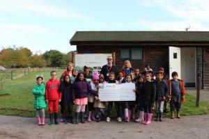 Paul Webster and Andy More visited the Ufton Court Educational Trust to present a cheque for the proceeds from the Englefield 10k run, which was £2725.