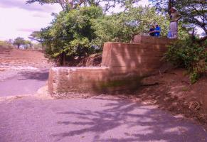 Sand Dam with Allan Smith wearing his Rotary Club of Jersey polo shirt