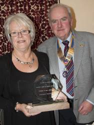 Pat Doel receiving the Trophy from President Ken