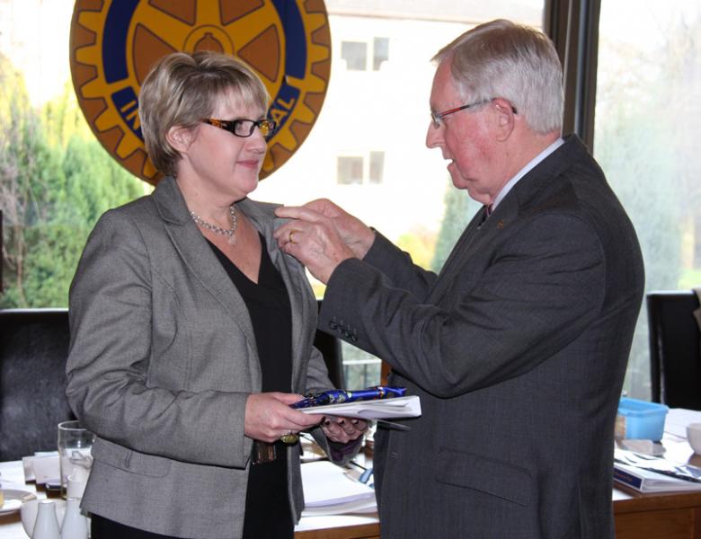 New Members - New Rotarian Tina Veater being welcomed by President Larry Taylor