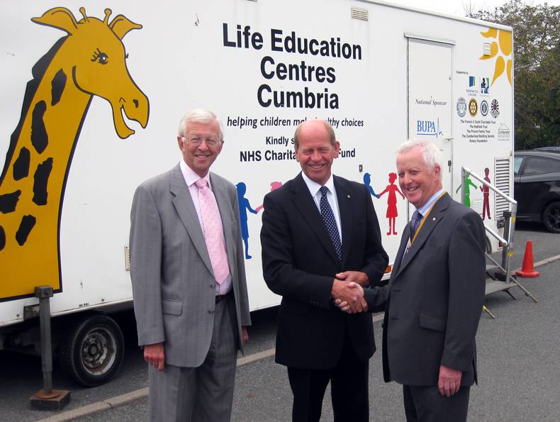 Rotary President Michael Pearson presents a cheque for £3,000 to Nick Utting Chairman of Life Education Cumbria.