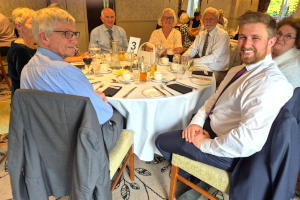 People sitting around a dinging table