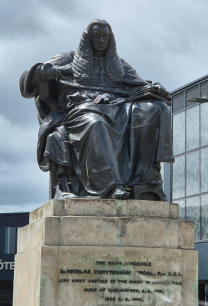 Bronze statue of a seated judge